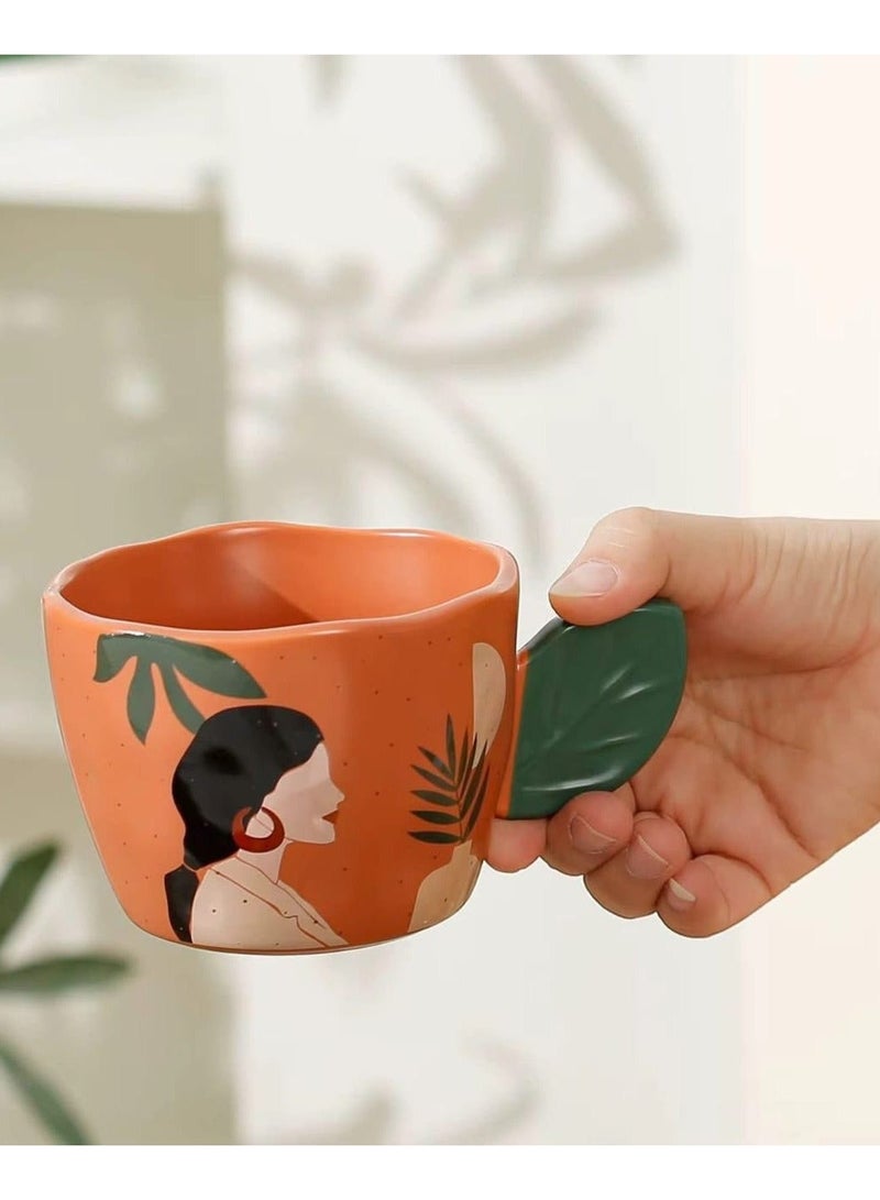 مج بورسيلين راقي سعة 360 ملي باللون البرتقالي التراكوتا مع مقبض مبتكر على شكل ورقة شجر خضراء وتصميم فني لوجه امرأة ونباتات استوائية - Image 2